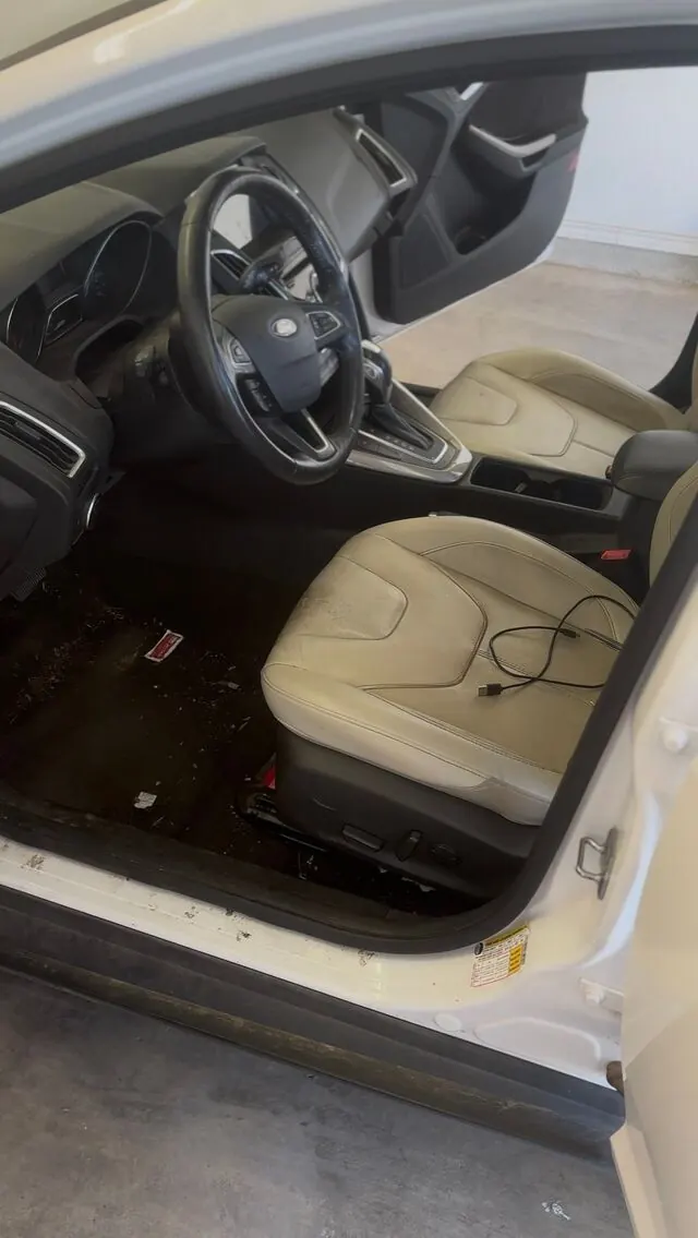 Ford interior before: stained seats and dirty floor