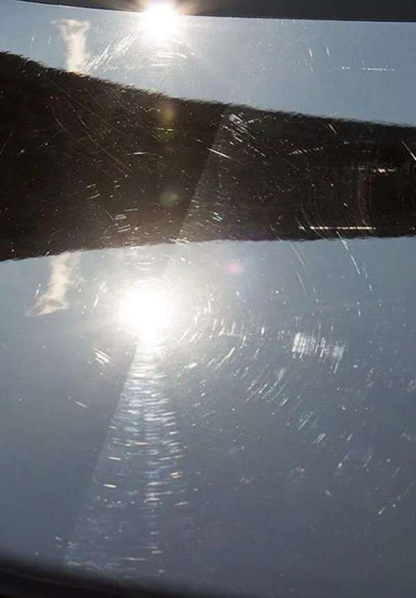 Gray hood before correction: heavy circular swirls around the sun reflection